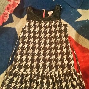 A black and white knee length dress